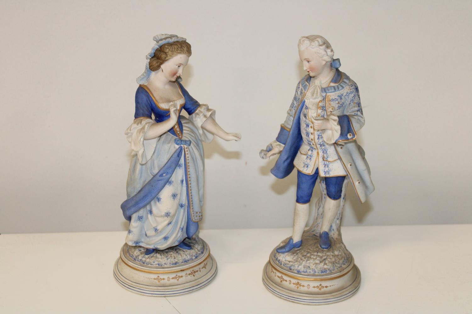 A pair of late 19th century Dresden ceramic figures 27cm cm tall