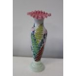 A vintage hand painted glass vase 26cm tall