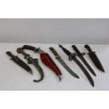 A collection of assorted knives etc