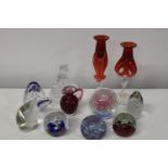 A selection of assorted paperweights & glass ware