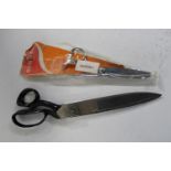 A pair of vintage Wilkinson seamstress scissors 13 inches. And a pair of Singer scissors-