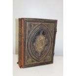 A large Victorian family bible with brass clasp