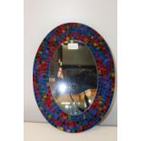 A coloured glass mirror 40cm x 30cm