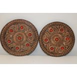 Two Tibetan wooden plaques 33cm in diameter