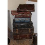 A job lot of vintage suitcases etc