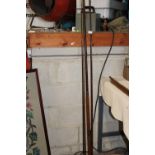 A vintage Hardy fishing rod with finials to end (one eye missing) collection only