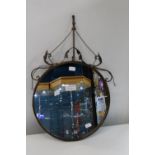 An unusual metal bound mirror 48cm in diameter collection only