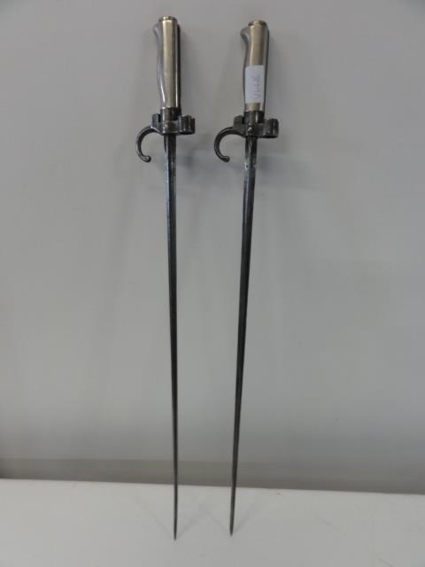 A pair of French 1886 pattern Label Epee style bayonets with cruciform blades