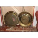 Two large brass chargers 60cm in diameter