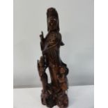 A large hard wood Chinese carving 46cm tall