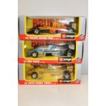 Three boxed Burago 1:24 scale F1 models