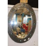 A vintage Arts & Crafts bevelled edged mirror with hand beaten decoration 75cm x 56cm collection
