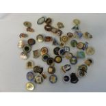 A large quantity of vintage pin badges