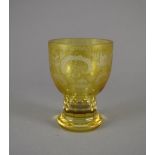 Pokal. Bernsteinfarben lüstriertes Glas mit Egermann-Dekor. Facettierte kurze Schäftung. 1. H. 20.