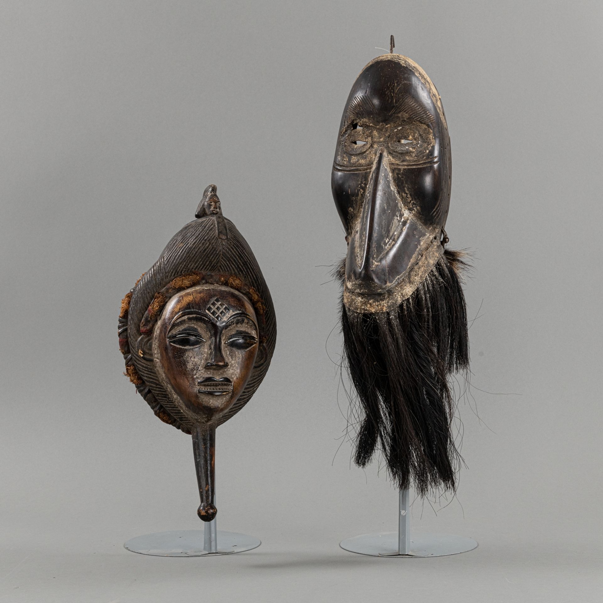 TWO CARVED WOOD MASKS