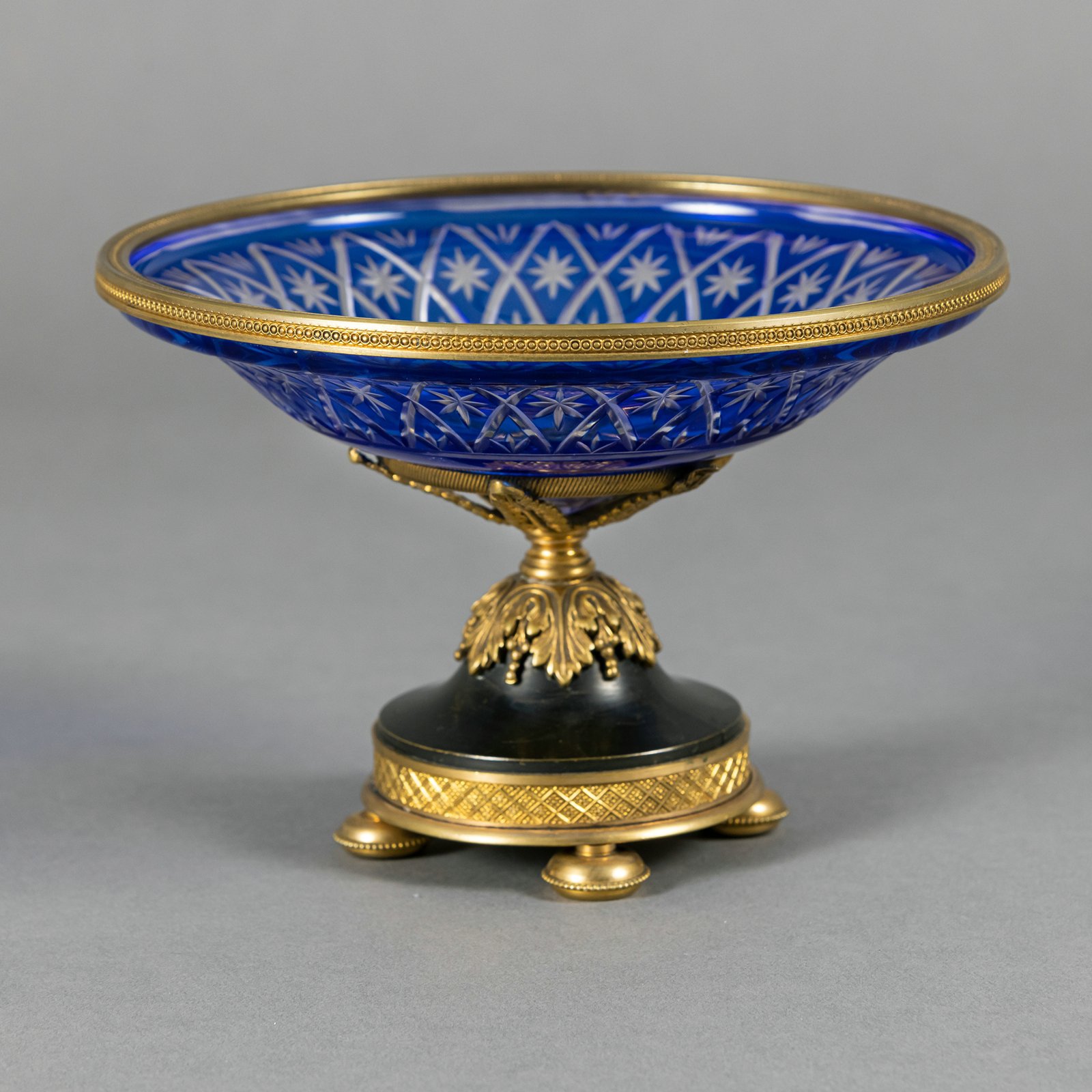 A CUT BLUE AND COLOURLESS FOOTED GLASS BOWL