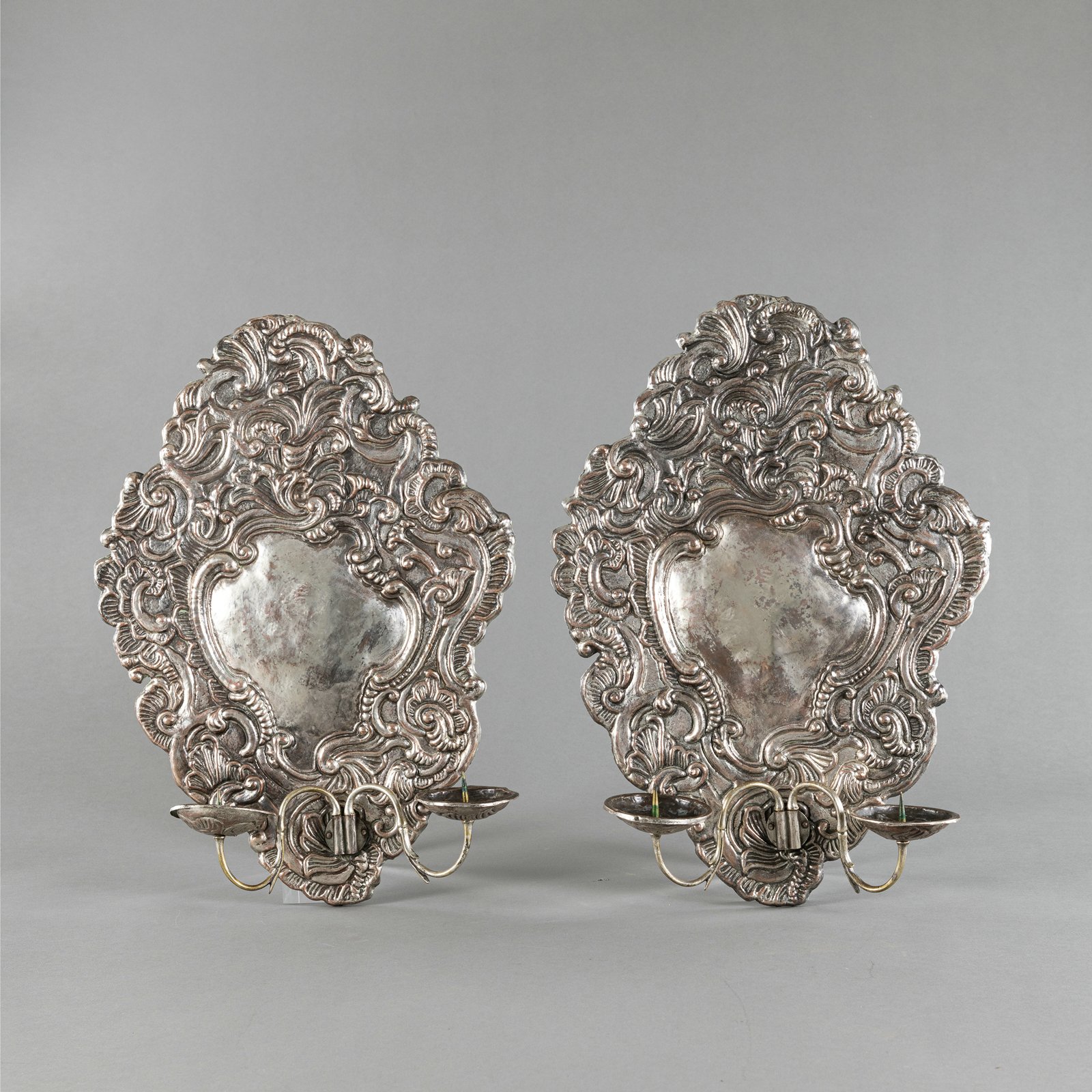 A PAIR OF COPPERPLATE ROCOCO WALL LIGHTS