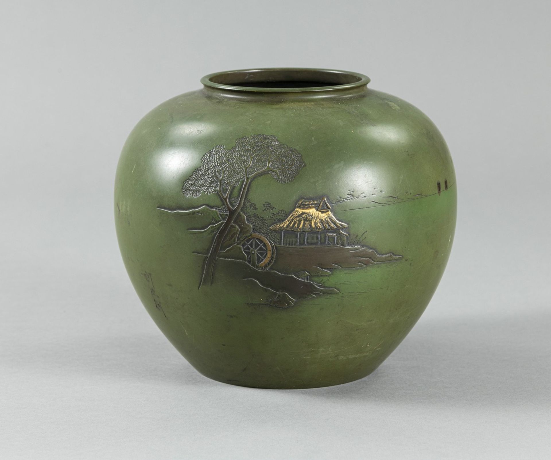 A GREEN-PATINATED BRONZE VASE