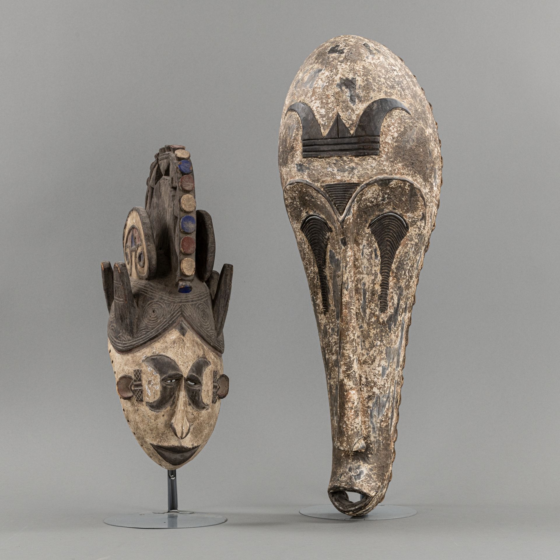 TWO CARVED WOOD MASKS IN  FANG-STYLE