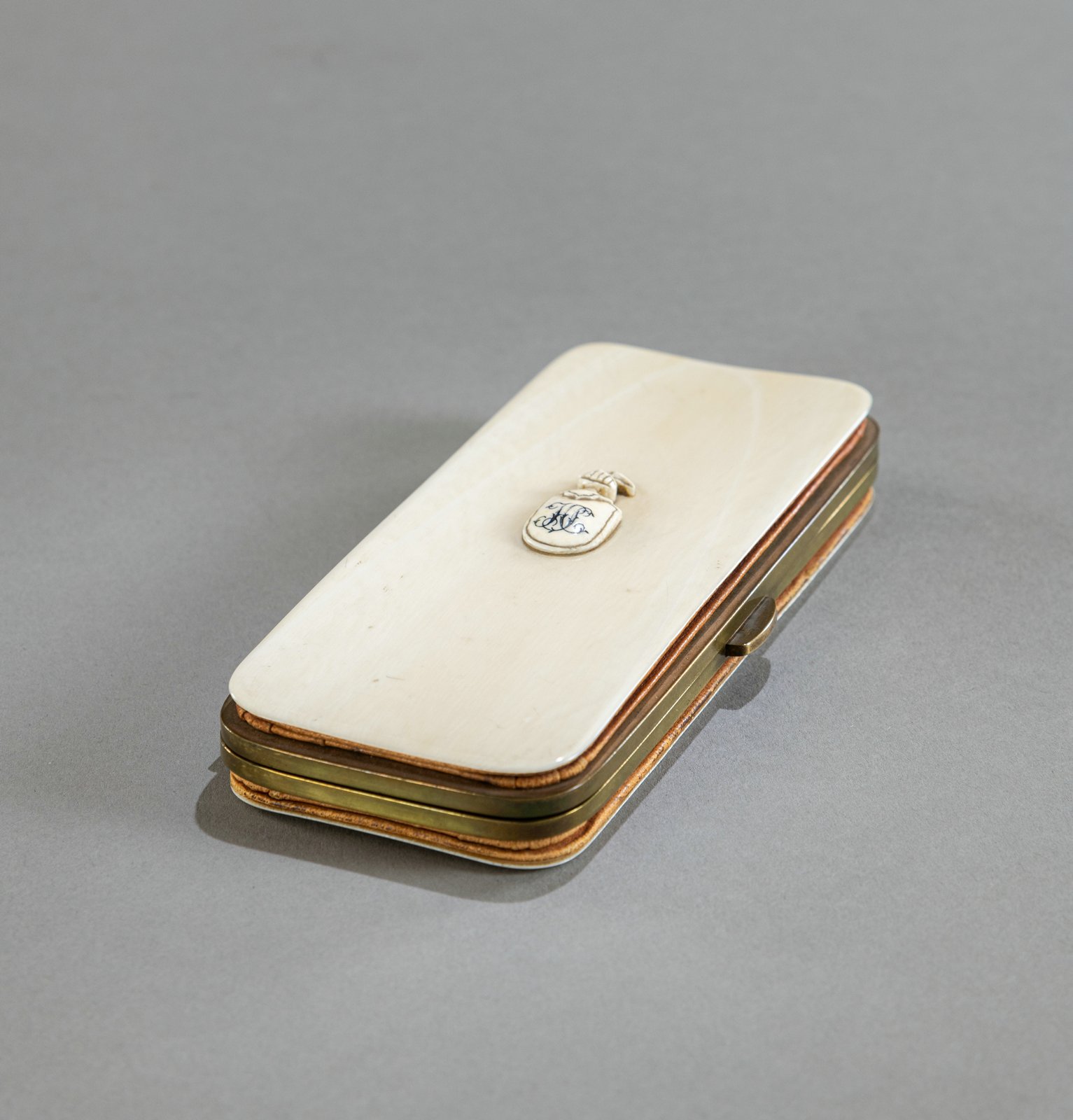 AN IVORY SMALL CASE