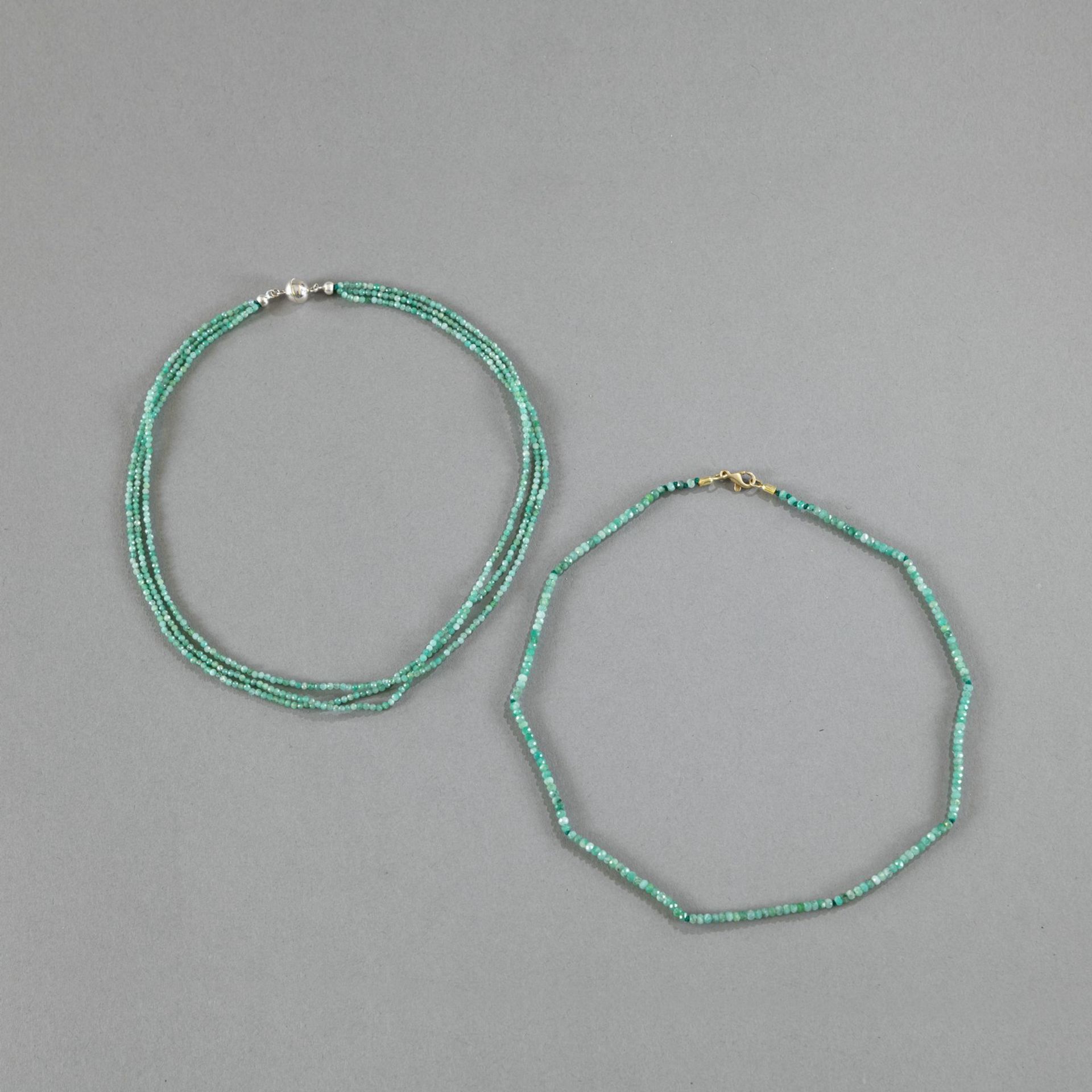 TWO EMERALD NACKLACES