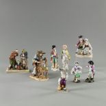 Acht Porzellanfiguren und -gruppen