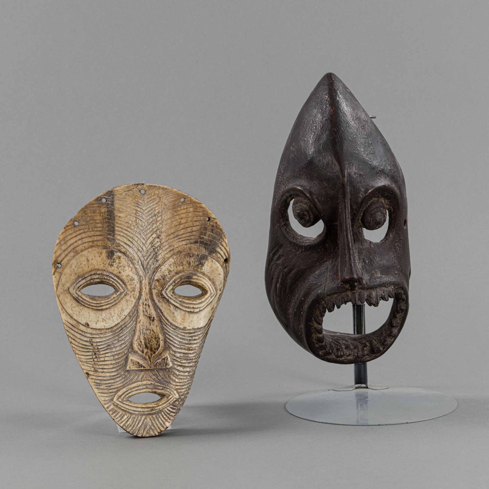 A  LEGA/ ZAIRE BONE MASK, AND A WOODEN MASK