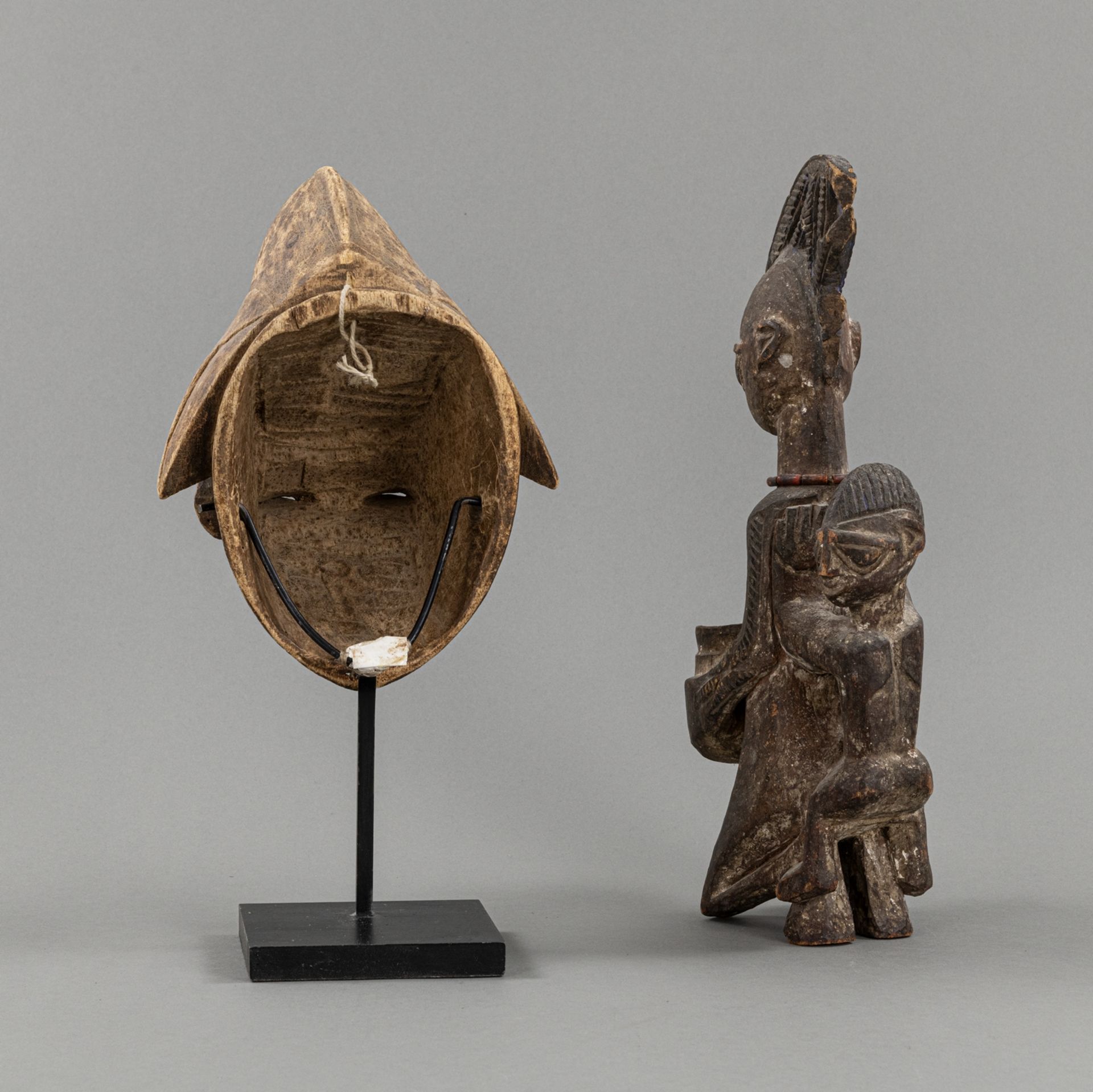 A CARVED  WOOD FIGURE OF A MOTHER WITH CHILD AND A WOOD PUNU- MASK - Image 3 of 3