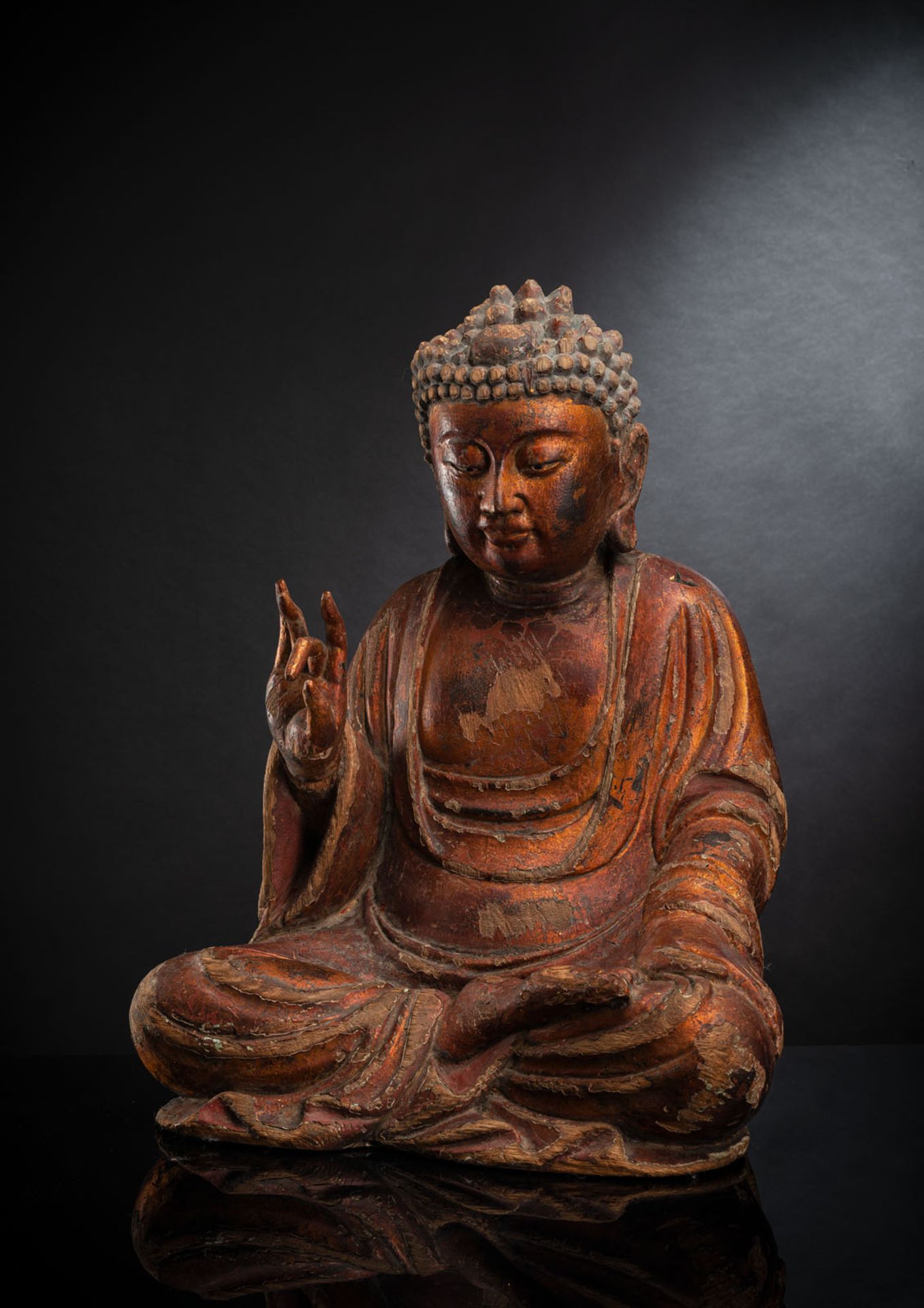 A GILT-LACQUERED CARVED WOOD FIGURE OF SEATED BUDDHA SHAKYAMUNI