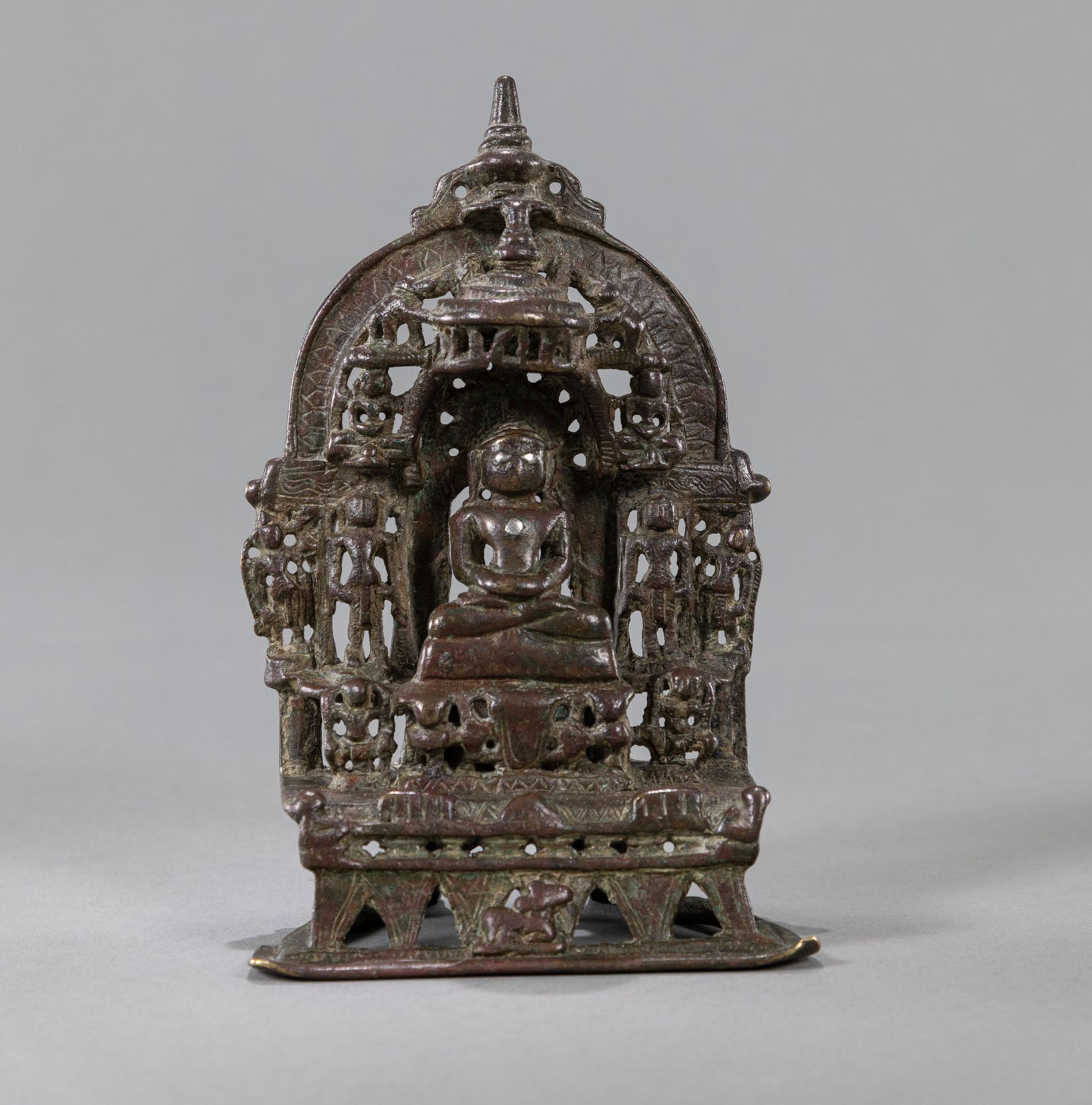 A JAIN COPPER ALTAR WITH TIRTANKARA WITH SILVER-INLAYS