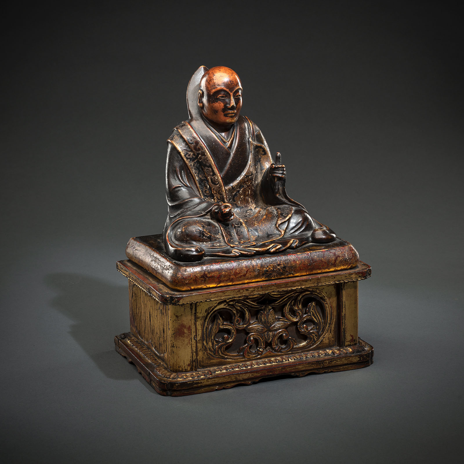 A LACQUERED AND PAINTED WOOD FIGURE OF NICHIREN SHÔNIN (1222 - 1282)
