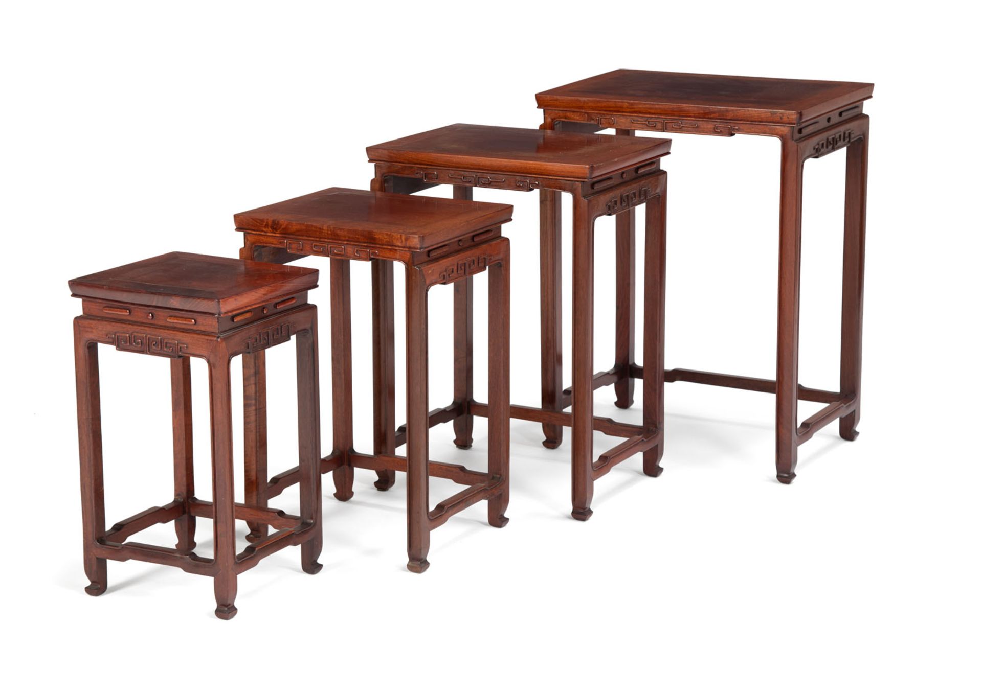 A SET OF FOUR HUALI NESTING TABLES