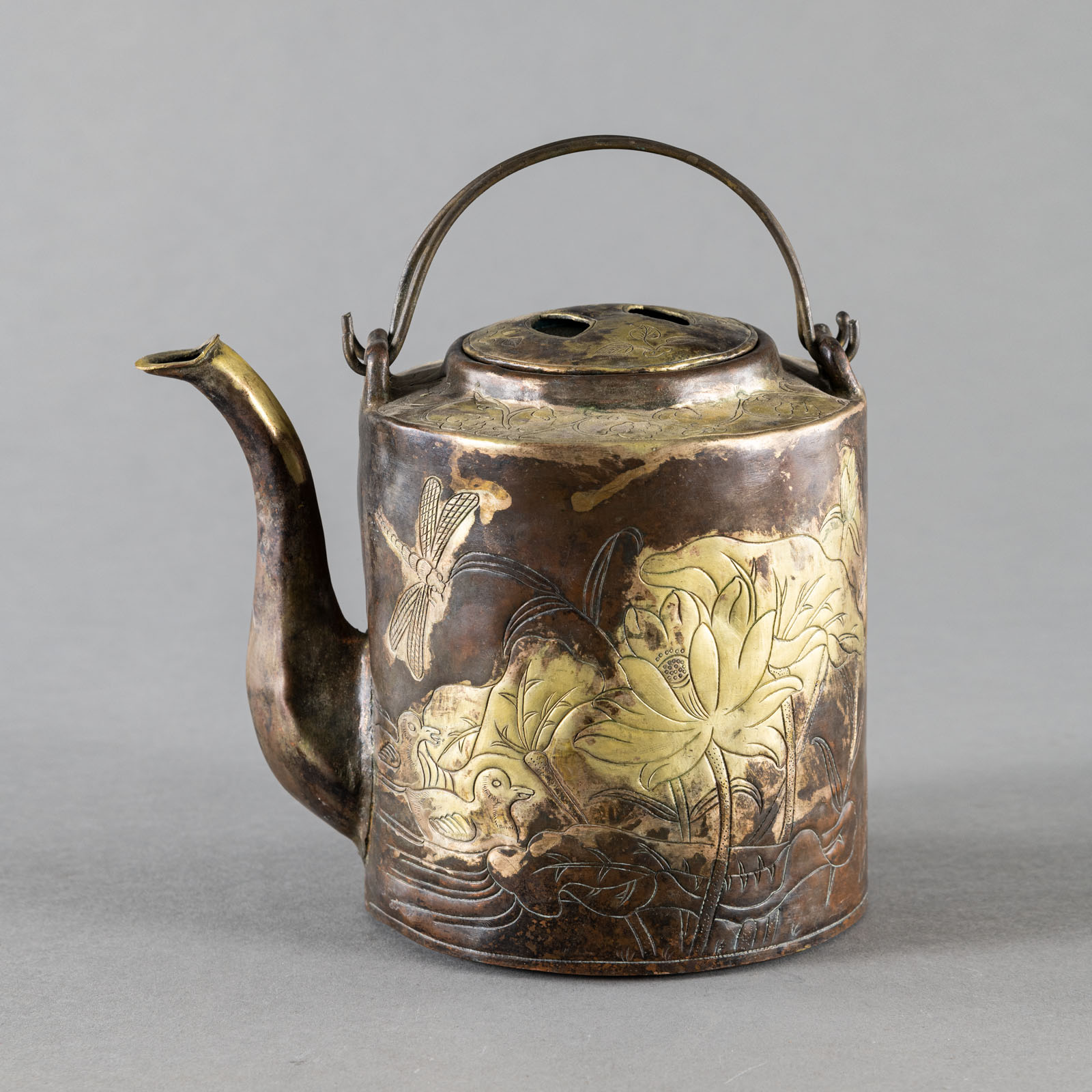 A PART-GILT COPPER EWER AND COVER WITH LOTOS