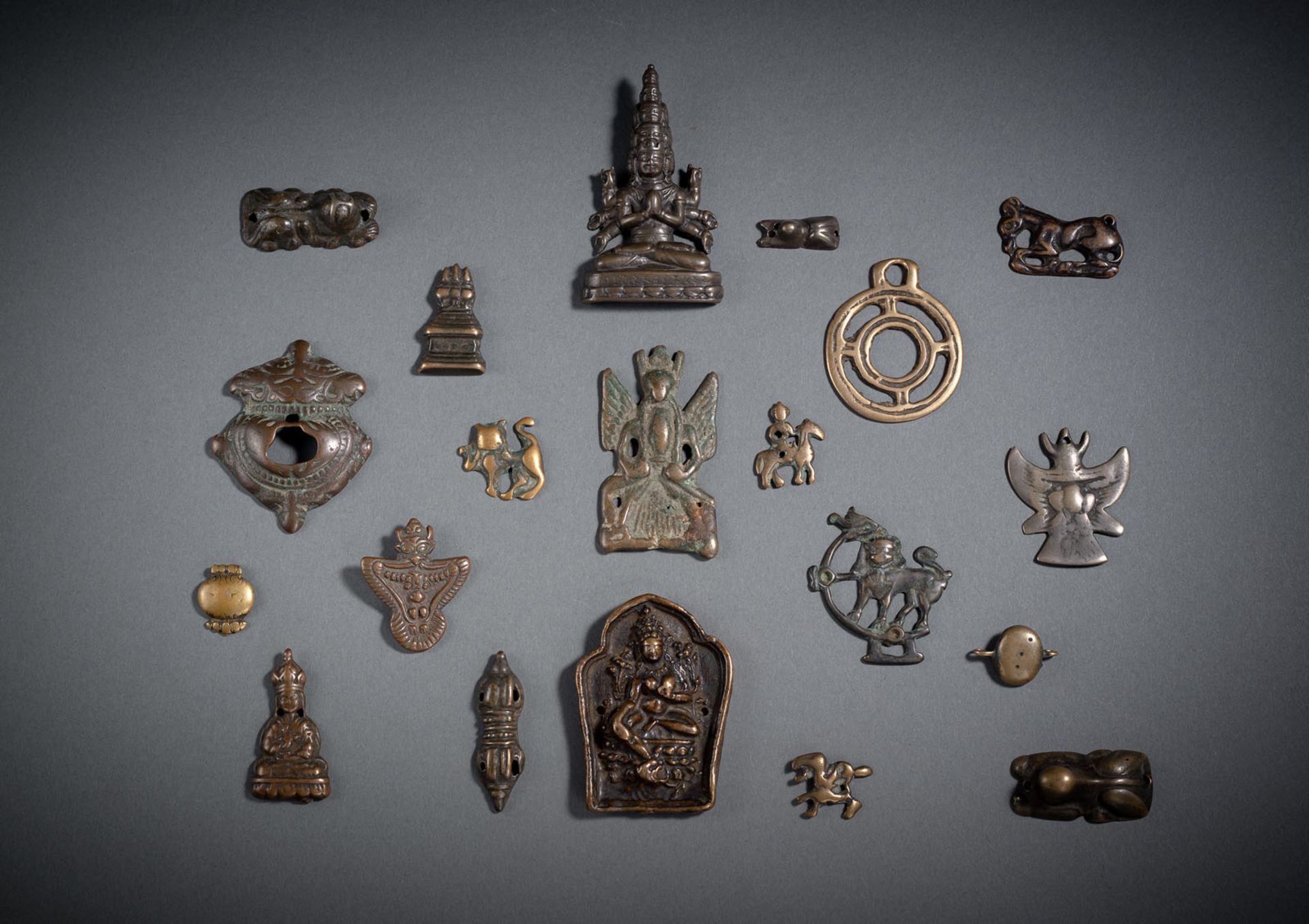 TWENTY IRON AND BRONZE AMULETS, TSOGLI