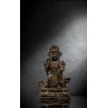 Bronze des Guanyin auf einem Löwen mit Spuren von Fassung