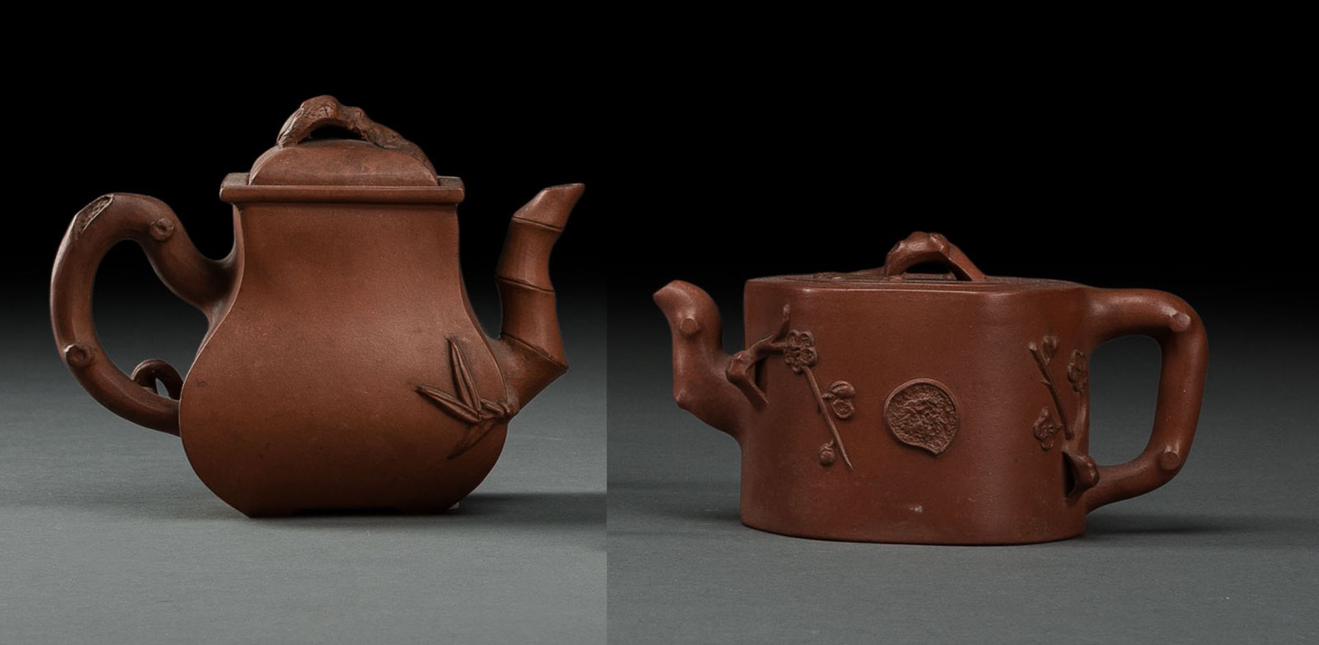 TWO ZISHA TEAPOTS AND COVERS WITH MOLDED  FLOWER BRANCHES