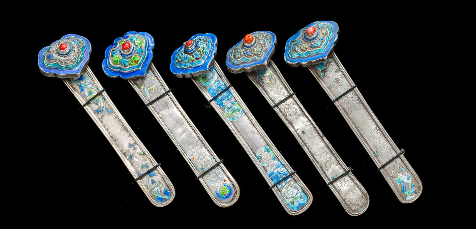 A GROUP OF FIVE SILVER HAIRPINS WITH ENAMEL