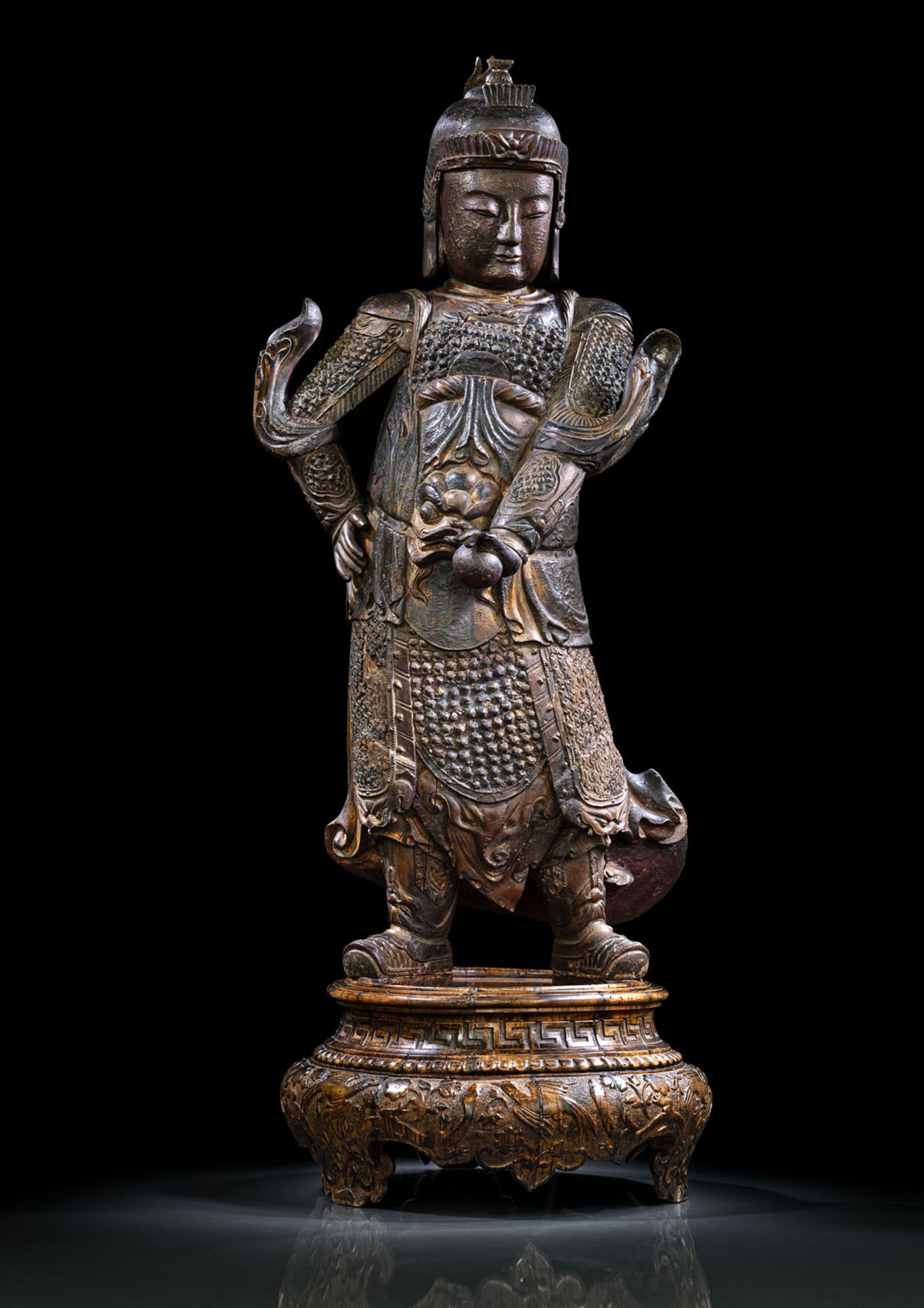 A RARE LARGE GILT- AND RED LACQUERED WOOD FIGURE OF SKANDA