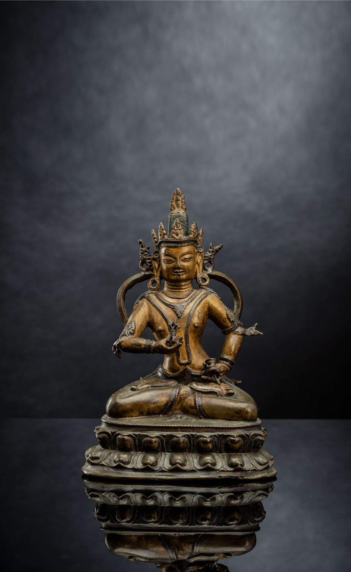 A PARCEL COLD-GILDED BRONZE FIGURE OF VAJRASATTVA