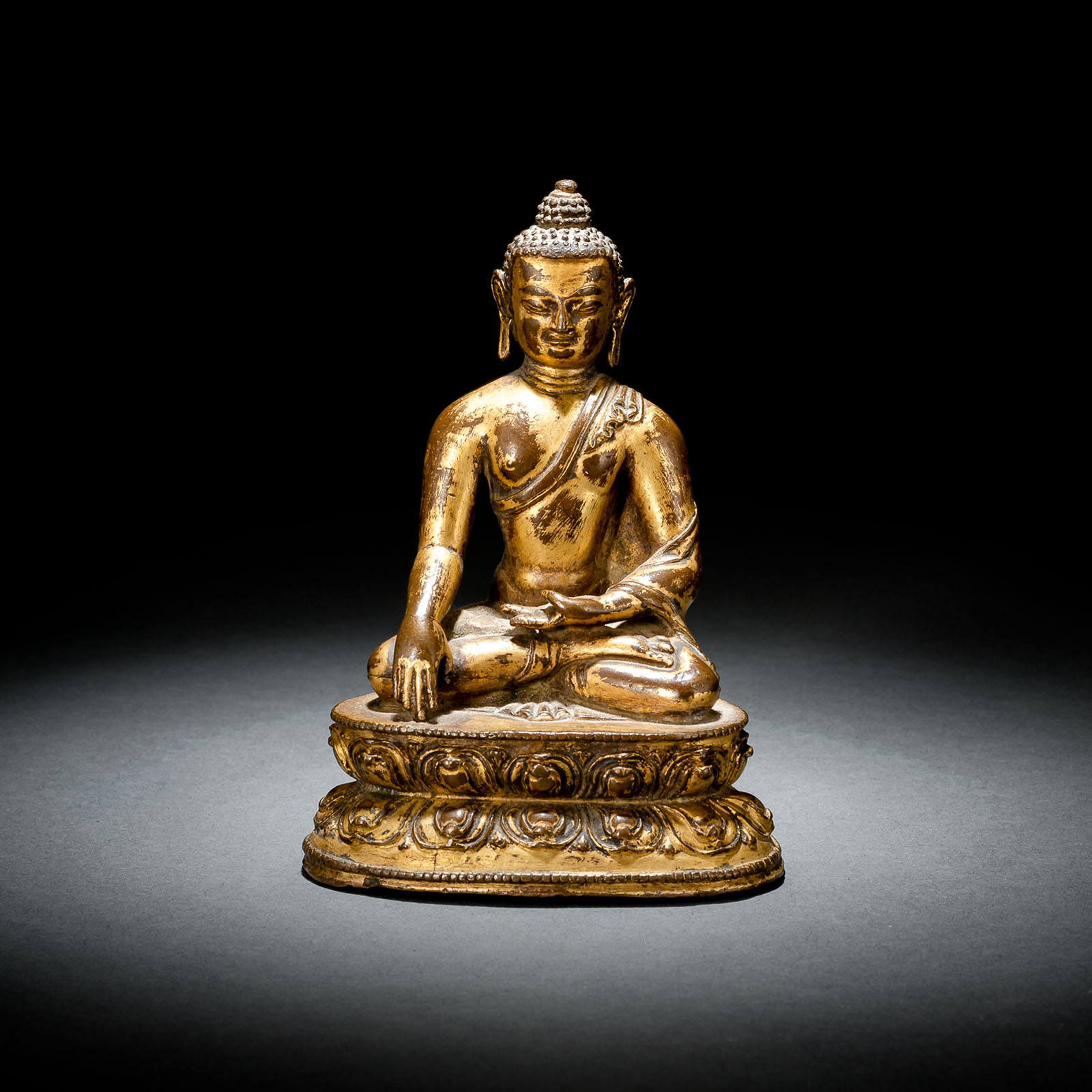 A GILT-BRONZE FIGURE OF BUDDHA SHAKYAMUNI