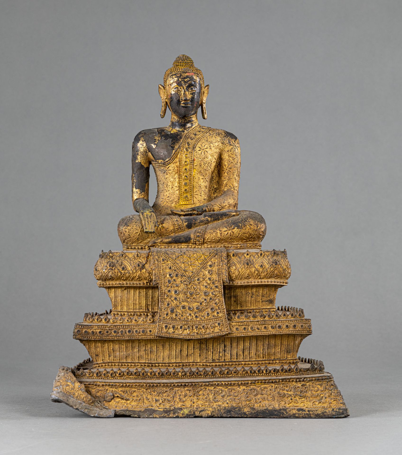A BRONZE FIGURE OF BUDDHA ON A THREE-TIERED THRONE