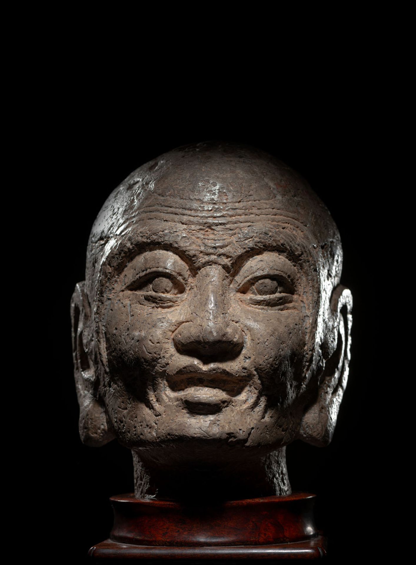 A RARE STONE HEAD OF PROBABLY KASYAPA