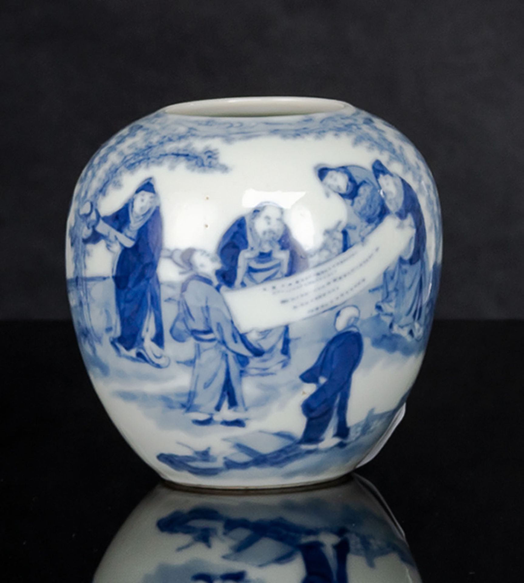 A GLOBULAR BLUE AND WHITE PORCELAIN WITH SCHIOLARS LOOKING AT A CALLIGRAPHY