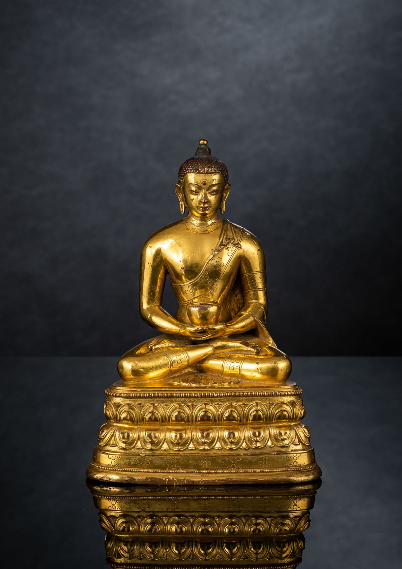 A FINE GILT-BRONZE FIGURE OF BUDDHA SHAKYAMUNI IN ZANABAZAR STYLE