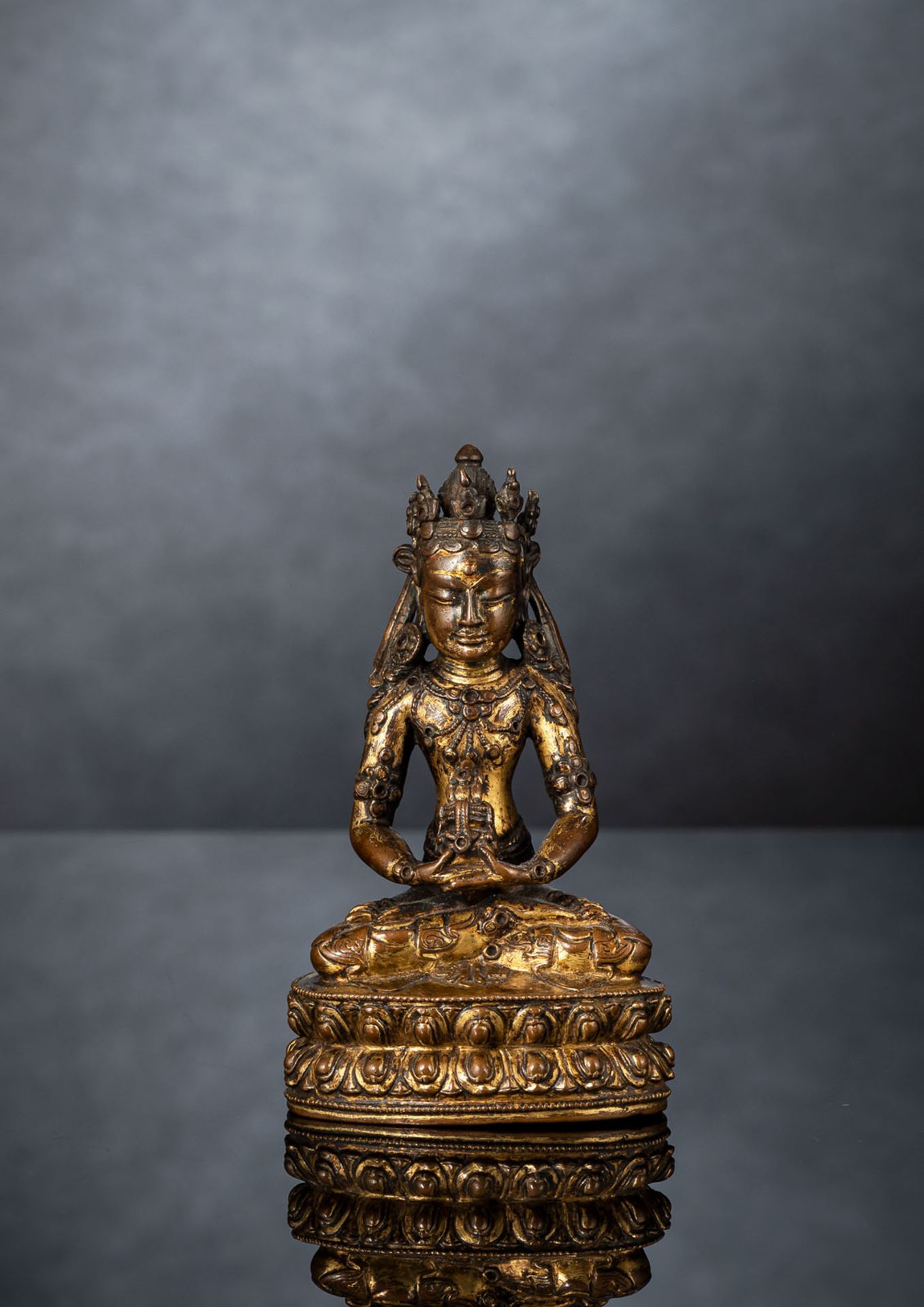 A FINE GILT-BRONZE FIGURE OF AMITAYUS