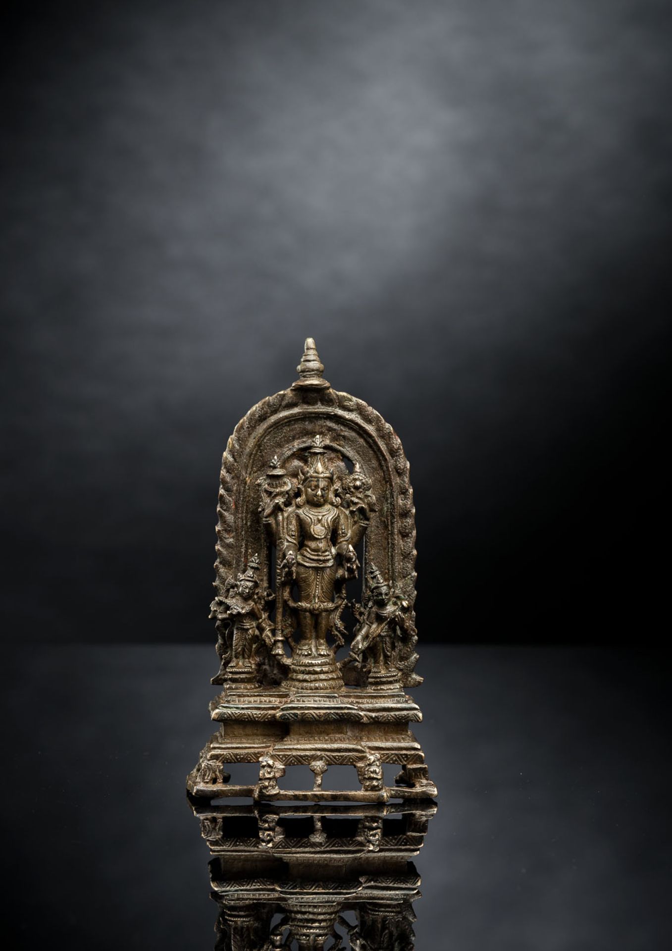 A BRONZE FIGURE OF VISHNU