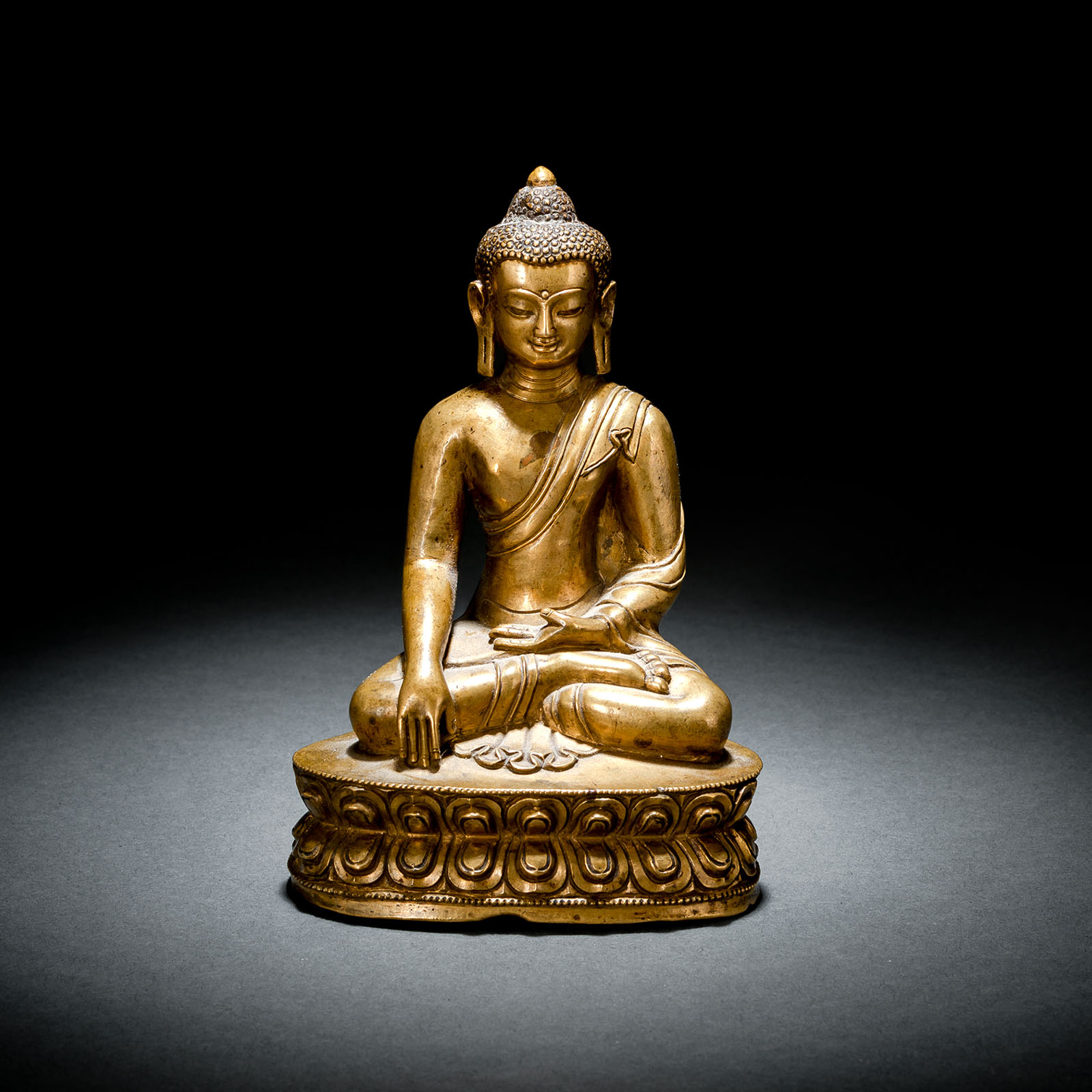 A BRONZE FIGURE OF BUDDHA SHAKYAMUNI