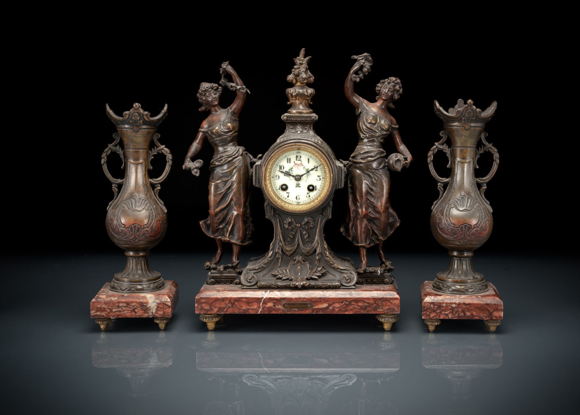 A FRENCH ART-NOUVEAU BRONZE AND MARBLE THREE-PIECE CLOCK GARNITURE