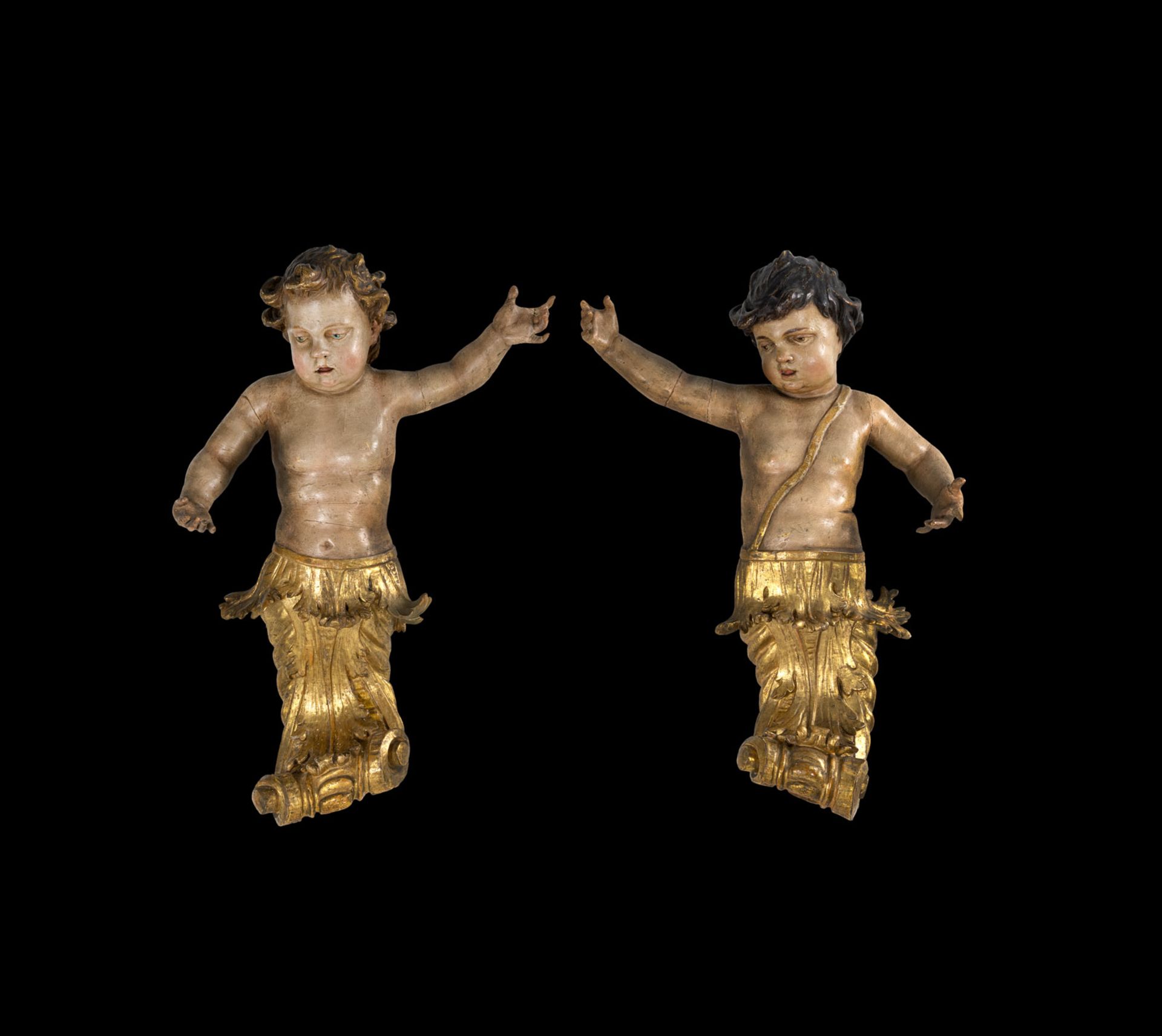 A PAIR OF ROCOCO PUTTI ON ROCAILLES