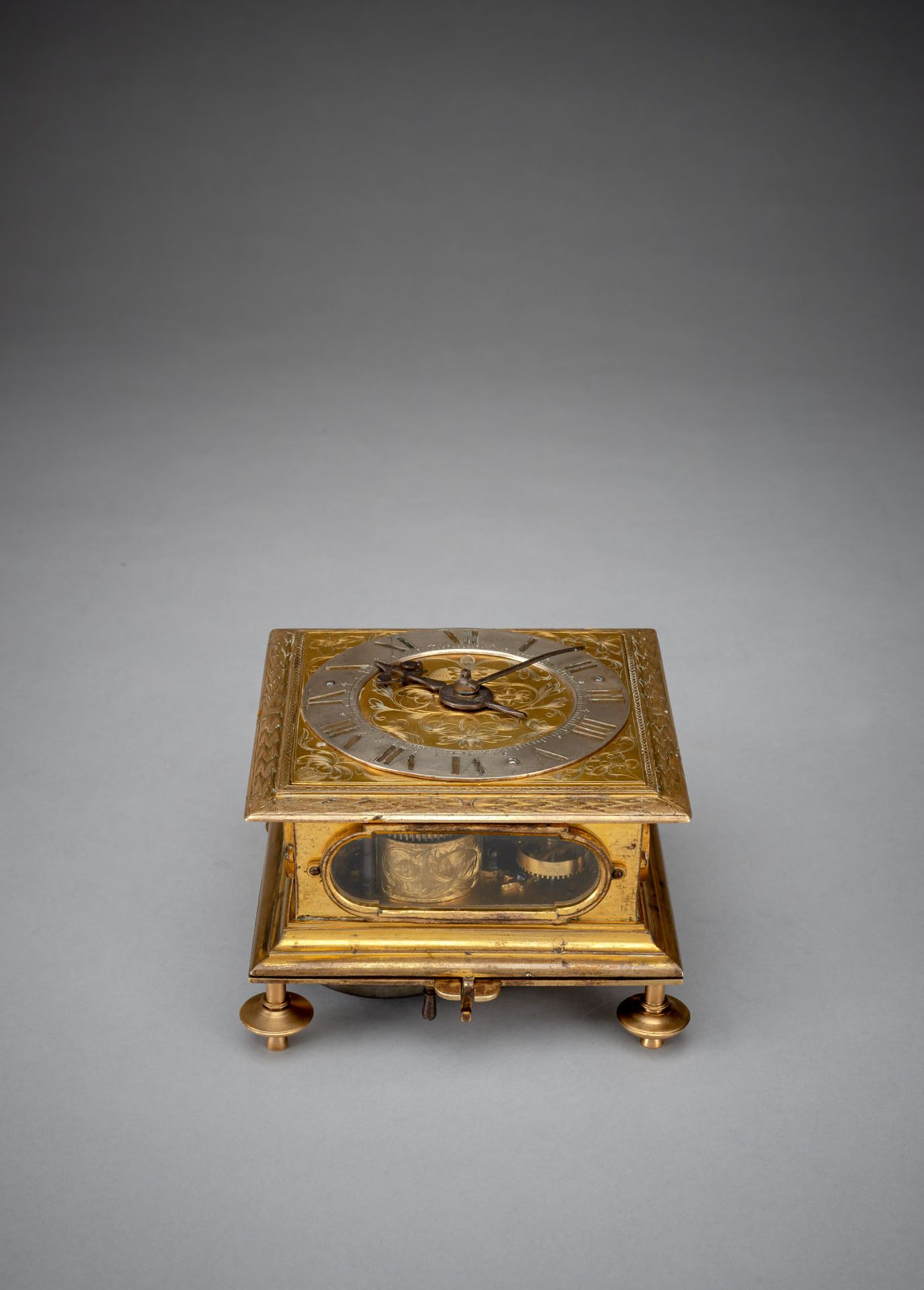 A GERMAN GILTBRASS SQUARE BAROQUE HORIZONTAL VERGE CLOCK